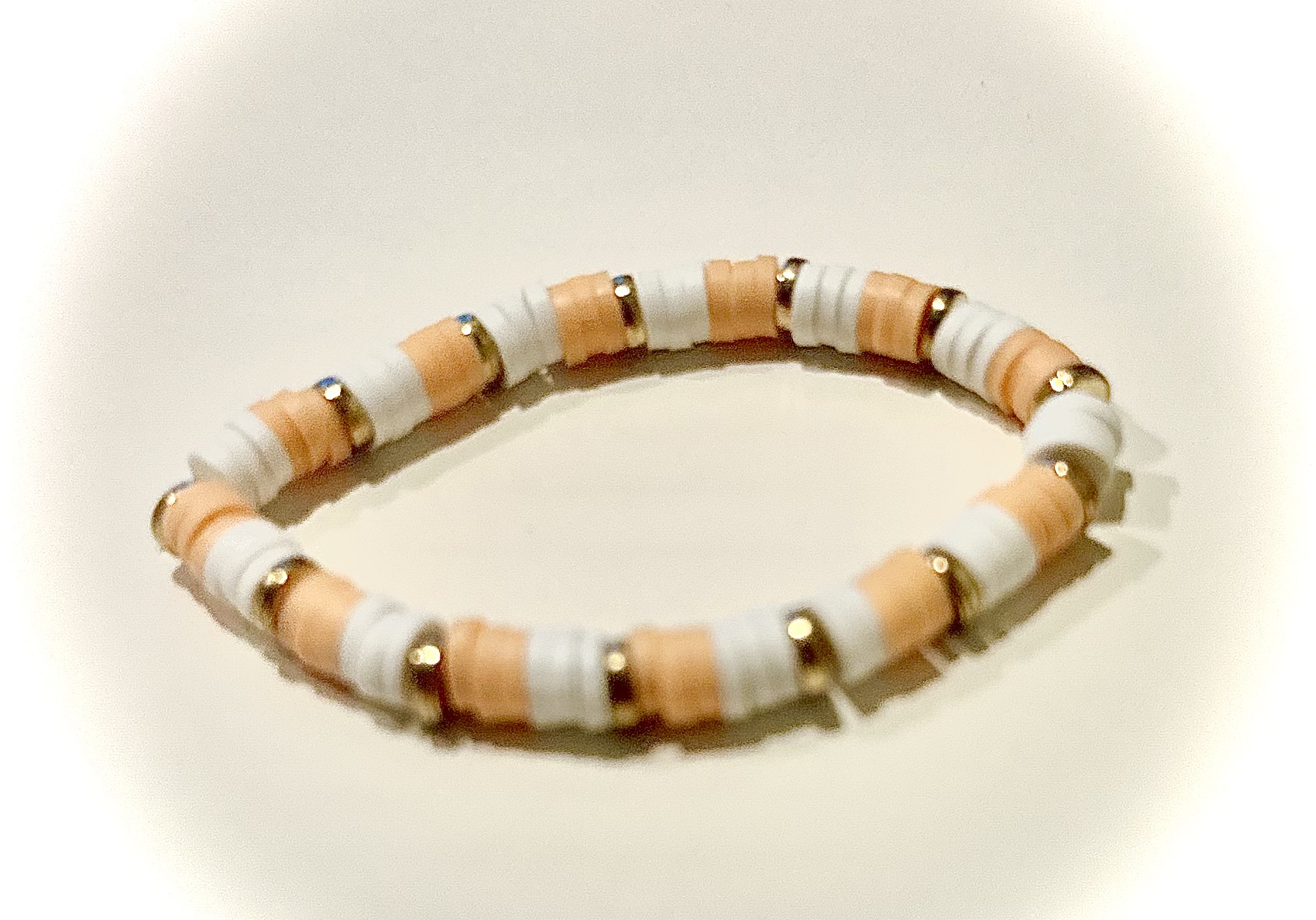 Creamsicle bracelet with white and tan beads